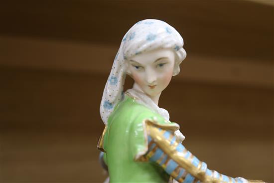 A pair of Paris porcelain figural bowls and a rolling pin